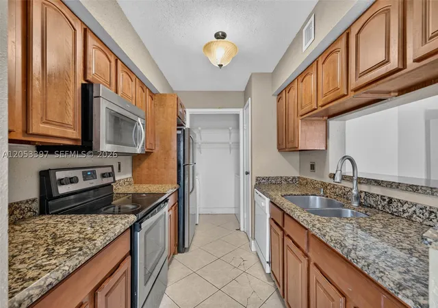 Photo 2 of Condo for sale at 995 Riverside Dr #120, Coral Springs, FL 33071 | MLS# A12053397 | Listing updated on 2026-08-26