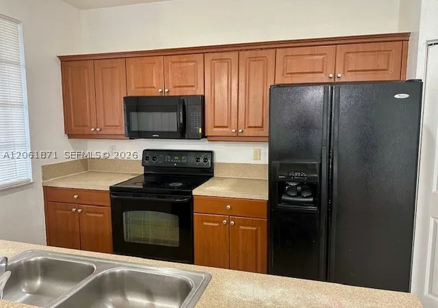 Photo 3 of Townhouse for sale at 1203 Abaco Ln, Riviera Beach, FL 33404 | MLS# A12061871 | Listing updated on 2026-07-30
