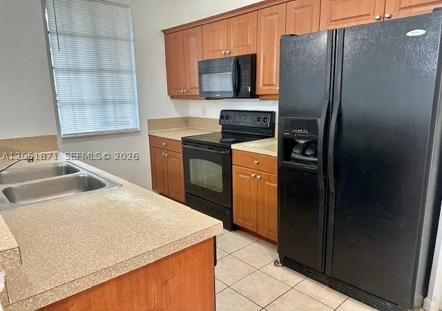 Photo 3 of Townhouse for sale at 1203 Abaco Ln, Riviera Beach, FL 33404 | MLS# A12061871 | Listing updated on 2026-07-30