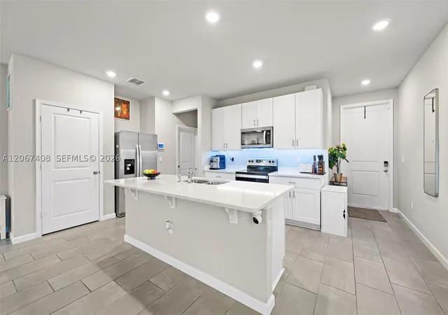 Photo 3 of Townhouse for sale at 1616 Lindley St, Mangonia Park, FL 33407 | MLS# A12067408 | Listing updated on 2026-08-07