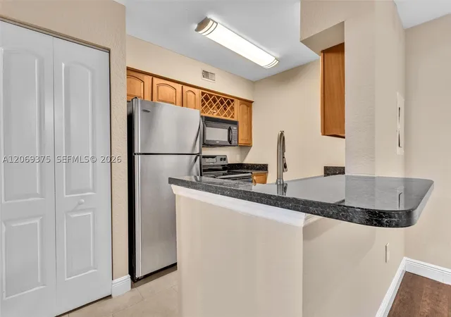 Photo 2 of Condo for sale at 2850 N Oakland Forest Dr #208, Oakland Park, FL 33309 | MLS# A12069375 | Listing updated on 2026-08-24