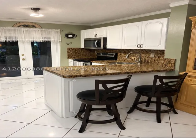 Photo 1 of Townhouse for sale at 2403 W 76th Street #102, Hialeah, FL 33016 | MLS# A12086980 | Listing updated on 2026-10-07