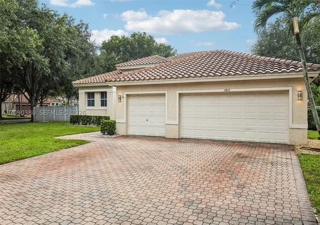 Single family home for sale at 5212 N 51st Street, Coconut Creek, FL 33073 | MLS# A12090380