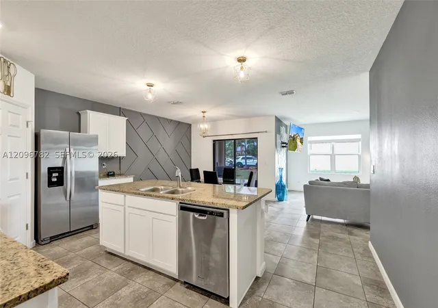 Photo 2 of Single family home for sale at 6479 Nw Castlebrook Ave, Port St Lucie, FL 34983 | MLS# A12096782 | Listing updated on 2026-09-28