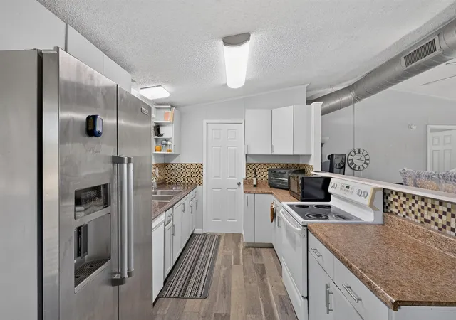 Photo 3 of Manufactured home for sale at 513 Fm 2336, Bastrop, TX 78602 | MLS# 3026320 | Listing updated on 2026-09-21