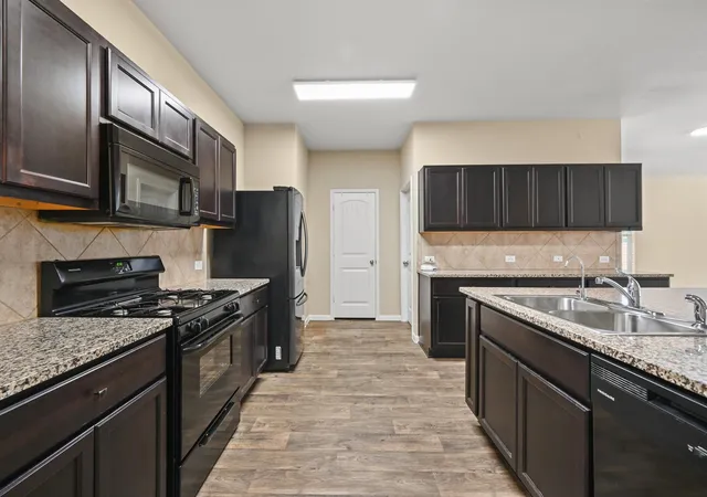 Photo 4 of Single family home for sale at 220 James Adkins Dr, Kyle, TX 78640 | MLS# 1409743 | Listing updated on 2026-10-09