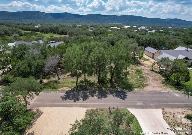 Photo 3 of Land for sale at 1697 (lot 63) Mountain Valley Dr, Concan, TX 78838 | MLS# 1807764 | Listing updated on 2025-03-06