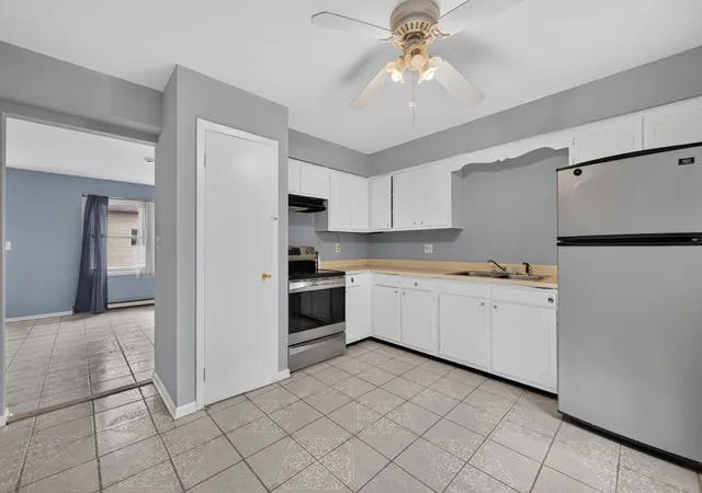Photo 3 of Multi family home for sale at 217 219 Stuart Ave, Aurora, IL 60505 | MLS# 12746711 | Listing updated on 2026-09-19