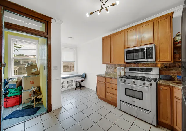 Photo 4 of Multi family home for sale at 5111 W Henderson St, Chicago, IL 60641 | MLS# 12755084 | Listing updated on 2026-09-25