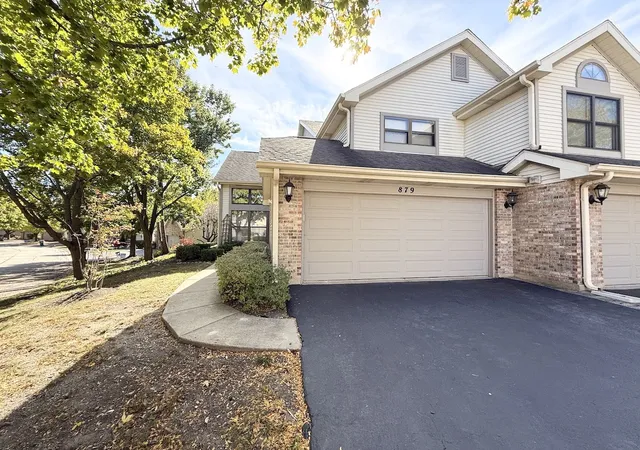 Photo 1 of Townhouse for sale at 879 N Auburn Woods Dr, Palatine, IL 60067 | MLS# 12761605 | Listing updated on 2026-09-23