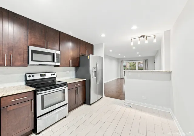 Photo 1 of Condo for sale at 400 E Kensington Rd #B, Mount Prospect, IL 60056 | MLS# 12785215 | Listing updated on 2026-10-21