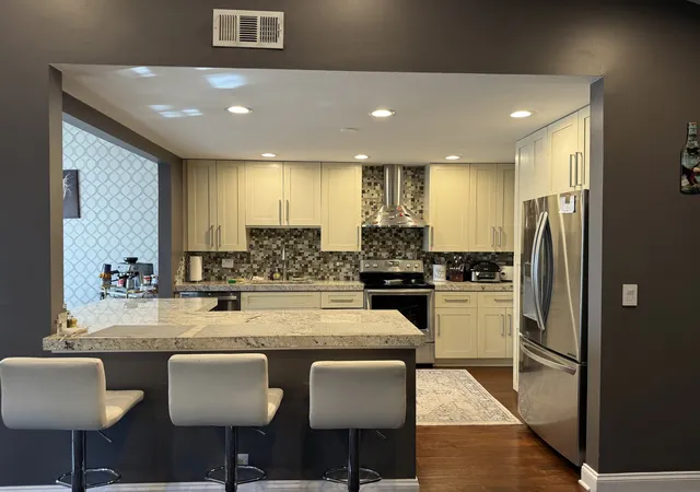 Photo 3 of Townhouse for sale at 1404 Plum Ct #C, Mount Prospect, IL 60056 | MLS# 12790301 | Listing updated on 2026-10-23
