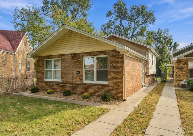 Single family home for sale at 7719 S Merrill Ave, Chicago, IL 60649 | MLS# 12795004