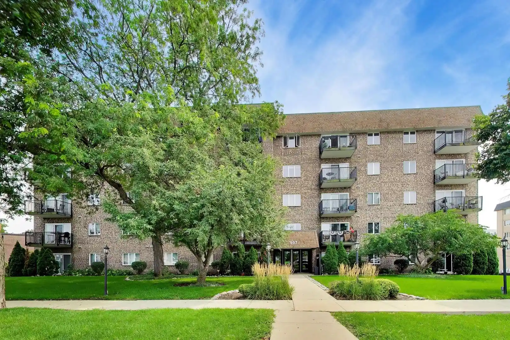 Listing Photo 1 - Condo for sale in 907 Curtiss St located at 907 Curtiss St, Downers Grove, IL 60515 - Unit #404