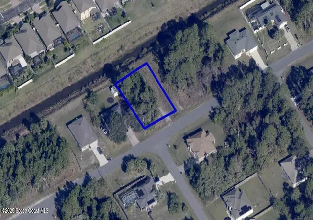 Photo 1 of Land for sale at 657 Paigo St Se, Palm Bay, FL 32909 | MLS# 1055474 | Listing updated on 2026-08-25