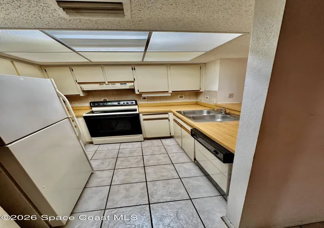 Photo 3 of Condo for sale at 915 Sonesta Ave Ne #102, Palm Bay, FL 32905 | MLS# 1057979 | Listing updated on 2026-09-07