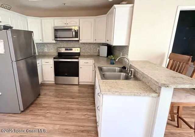 Listing Photo 5 - Condo for sale in building located at 7801 Maplewood Dr, West Melbourne, FL 32904 - Unit #916