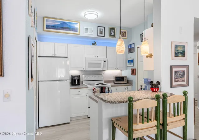 Listing Photo 5 - Condo for sale in building located at 5673 Star Rush Dr, Melbourne, FL 32940 - Unit #203