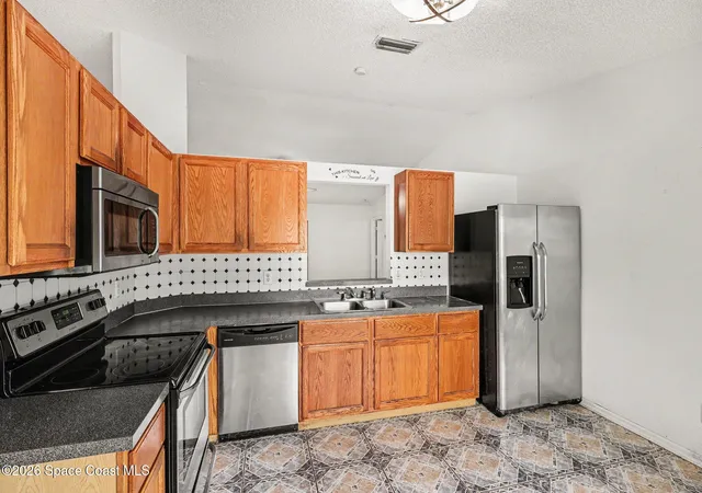 Photo 3 of Sale Pending at 1893 Firethorn Rd NW, Palm Bay, FL 32907 | MLS# 1077178 | Listing updated on 2026-07-11