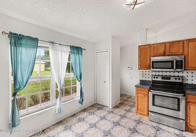 Photo 4 of Sale Pending at 1893 Firethorn Rd NW, Palm Bay, FL 32907 | MLS# 1077178 | Listing updated on 2026-07-11