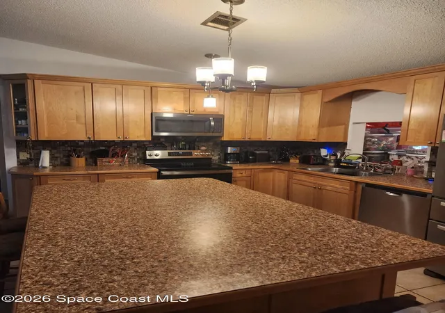 Photo 3 of Single family home for sale at 913 Commerce Rd SE, Palm Bay, FL 32909 | MLS# 1077817 | Listing updated on 2026-09-11