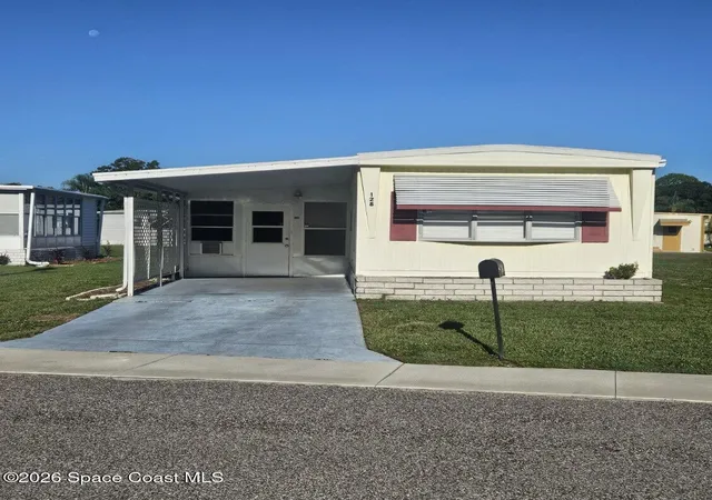 Photo 1 of Manufactured home for sale at 128 Mystic Blvd Ne, Palm Bay, FL 32907 | MLS# 1081692 | Listing updated on 2026-07-18