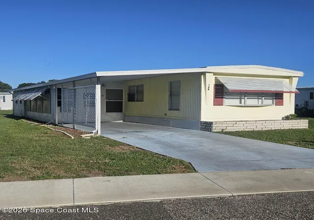 Photo 2 of Manufactured home for sale at 128 Mystic Blvd Ne, Palm Bay, FL 32907 | MLS# 1081692 | Listing updated on 2026-07-18
