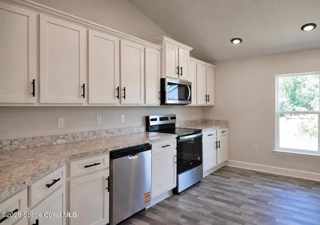 Photo 4 of Single family home for sale at 403 Ja Bombardier Blvd, Palm Bay, FL 32908 | MLS# 1082003 | Listing updated on 2026-10-08
