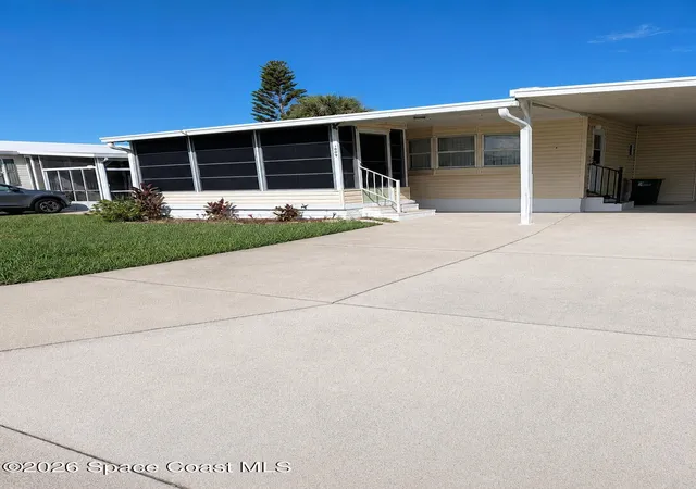 Photo 2 of Manufactured home for sale at 1009 Buttonwood St E, Barefoot Bay, FL 32976 | MLS# 1086136 | Listing updated on 2026-09-17