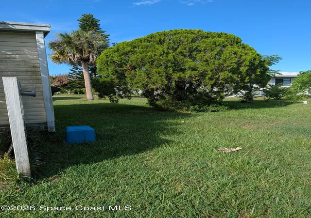 Photo 3 of Manufactured home for sale at 1009 Buttonwood St E, Barefoot Bay, FL 32976 | MLS# 1086136 | Listing updated on 2026-09-17