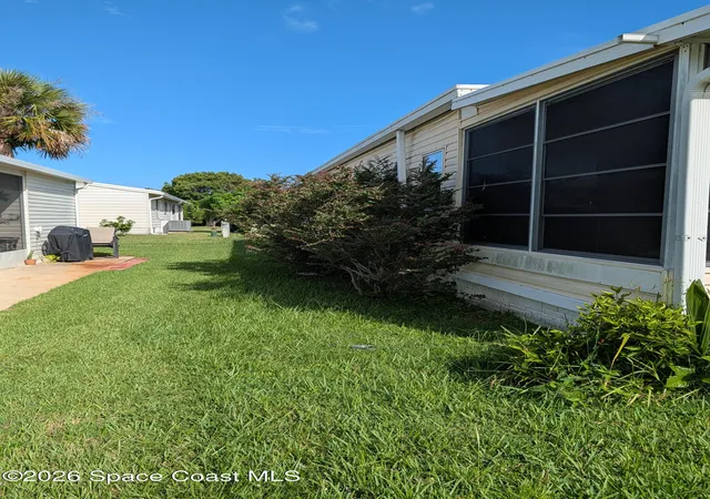 Photo 4 of Manufactured home for sale at 1009 Buttonwood St E, Barefoot Bay, FL 32976 | MLS# 1086136 | Listing updated on 2026-09-17