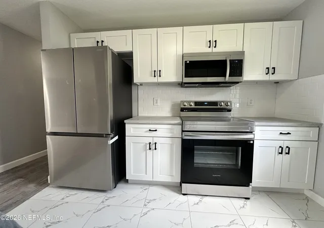 Photo 3 of Single family home for sale at 1394 Manotak Ave, Jacksonville, FL 32210 | MLS# 2149956 | Listing updated on 2026-09-15