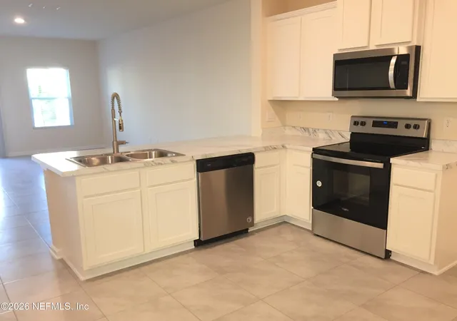 Photo 4 of Townhouse for sale at 7627 Legacy Trl, Jacksonville, FL 32256 | MLS# 2153412 | Listing updated on 2026-09-14