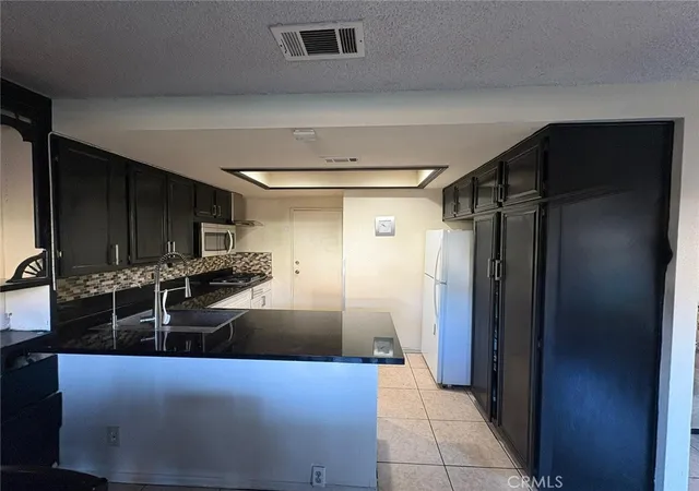 Photo 4 of Condo for sale at 6100 Arbutus Ave #42, Huntington Park, CA 90255 | MLS# PV25268642 | Listing updated on 2026-09-30
