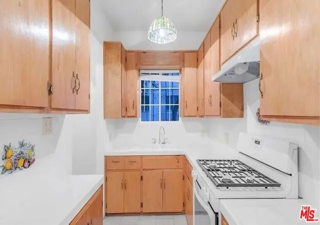 Listing Photo 1 - Condo for sale in building located at 5735 Camerford Ave, Los Angeles, CA 90038 - Unit #
