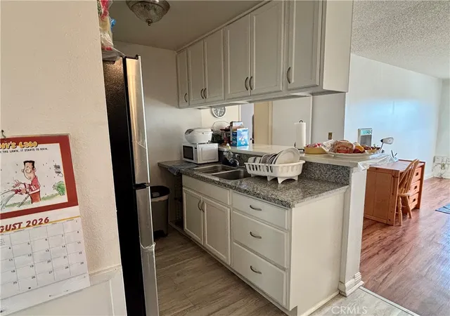 Listing Photo 1 - Condo for sale in building located at 5585 E Pacific Coast Hwy Unit 261, Long Beach, CA 90804 - Unit #