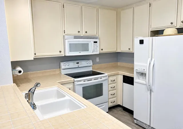 Listing Photo 1 - Condo for sale in building located at 10400 Caminito Cuervo, San Diego, CA 92108 - Unit #255
