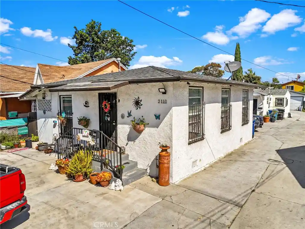Photo 1 of Multi family home for sale at 2111 E 118th Street, Los Angeles, CA 90059 | MLS# DW26192040 | Listing updated on 2026-10-24