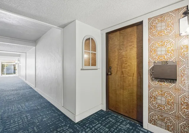 Listing Photo 1 - Condo for sale in building located at 12565 Oaks N Dr, San Diego, CA 92128 - Unit #115