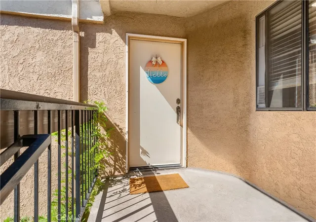 Listing Photo 1 - Condo for sale in building located at 16911 Eastlake Ln, Huntington Beach, CA 92647 - Unit #