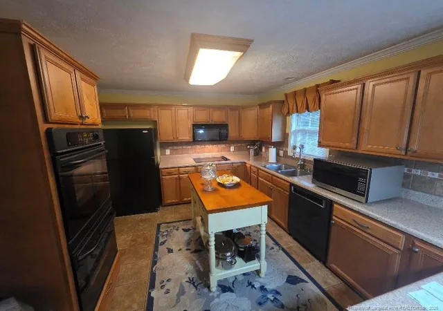 Photo 3 of Single family home for sale at 1102 Reflex St, Fayetteville, NC 28311 | MLS# 766518 | Listing updated on 2026-09-20