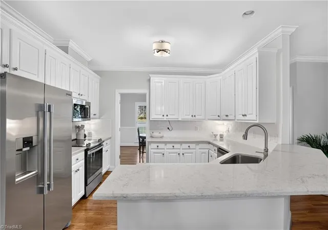 Photo 3 of Single family home for sale at 704 Glendevon Ct N, Whitsett, NC 27377 | MLS# 1230502 | Listing updated on 2026-09-07