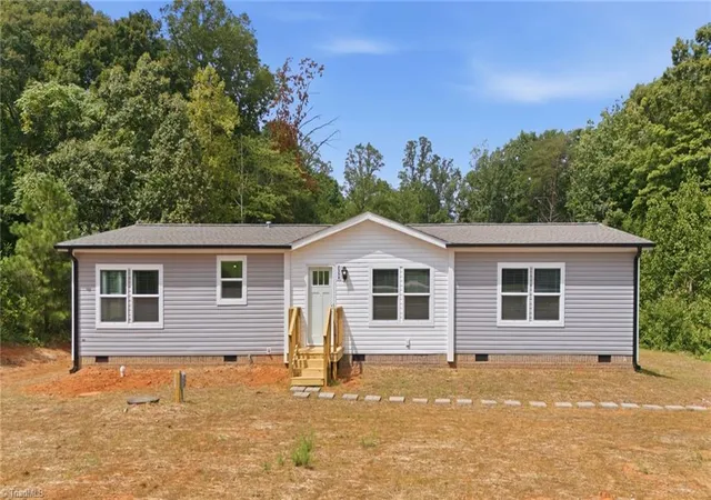 Photo 1 of Manufactured home for sale at 2554 Ellisboro Rd, Stokesdale, NC 27357 | MLS# 1233050 | Listing updated on 2026-09-10