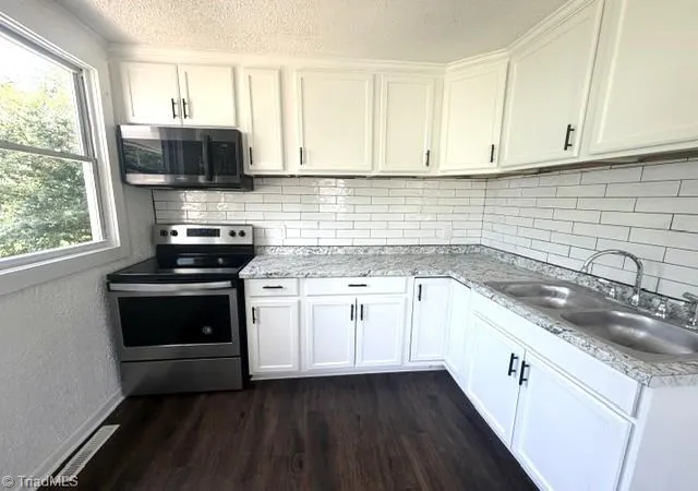 Photo 3 of Single family home for sale at 1048 E Clemmonsville Rd, Winston Salem, NC 27107 | MLS# 1229991 | Listing updated on 2026-09-17