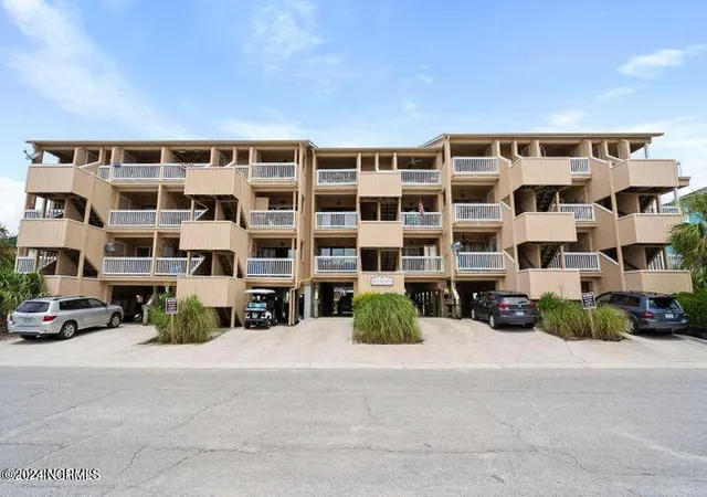 Listing Photo 1 - Condo for sale in building located at 1600 Canal Dr, Carolina Beach, NC 28428 - Unit #A19