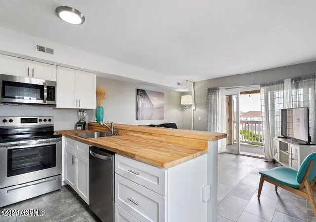 Listing Photo 5 - Condo for sale in building located at 1600 Canal Dr, Carolina Beach, NC 28428 - Unit #A19