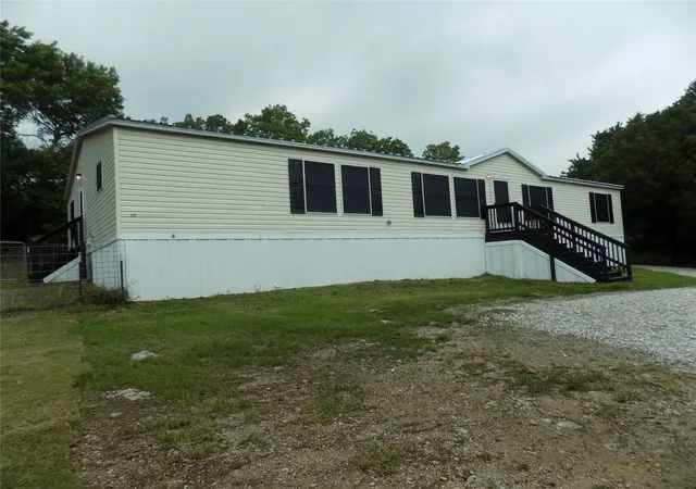 Photo 1 of Manufactured home for sale at 203 S Ridgeview Ct, Azle, TX 76020 | MLS# 21251015 | Listing updated on 2026-08-29
