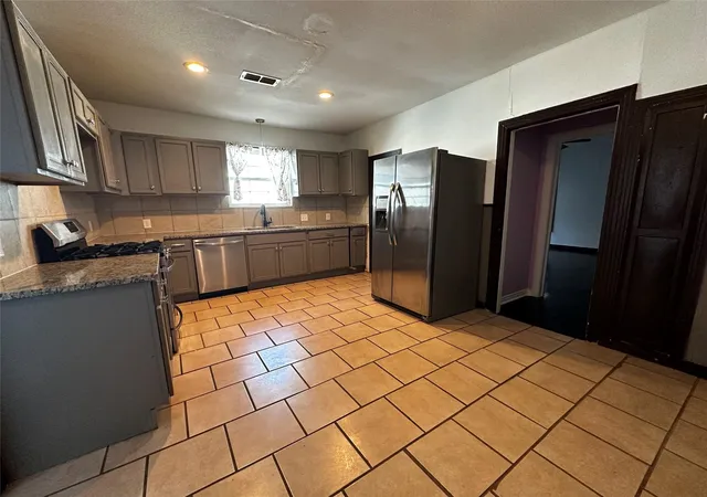 Photo 3 of Multi family home for sale at 1009 E Humbolt St, Fort Worth, TX 76104 | MLS# 21282004 | Listing updated on 2026-10-02
