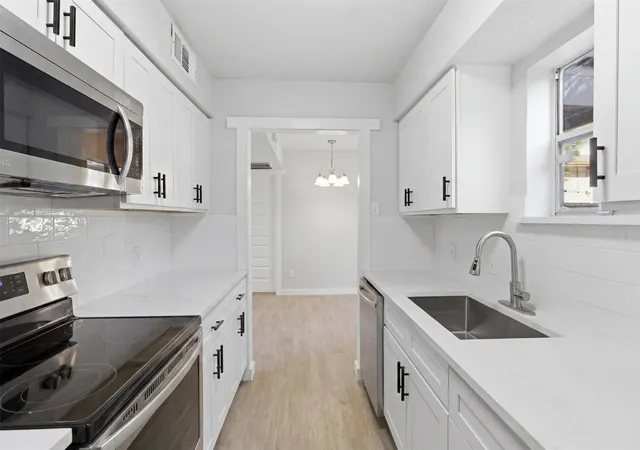 Listing Photo 1 - Condo for sale in building located at 10574 High Hollows Dr, Dallas, TX 75230 - Unit #165