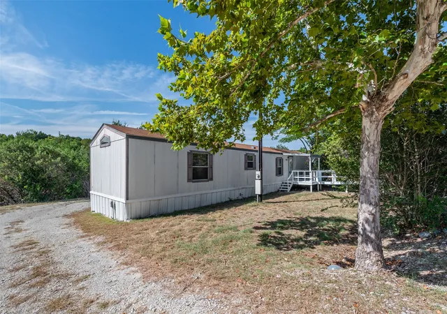 Photo 2 of Manufactured home for sale at 1321 Phoenix Ct, Granbury, TX 76048 | MLS# 21289988 | Listing updated on 2026-08-22